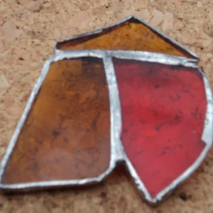 Broche orange en forme de chapeau chinois