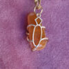 Branche orange dos collier