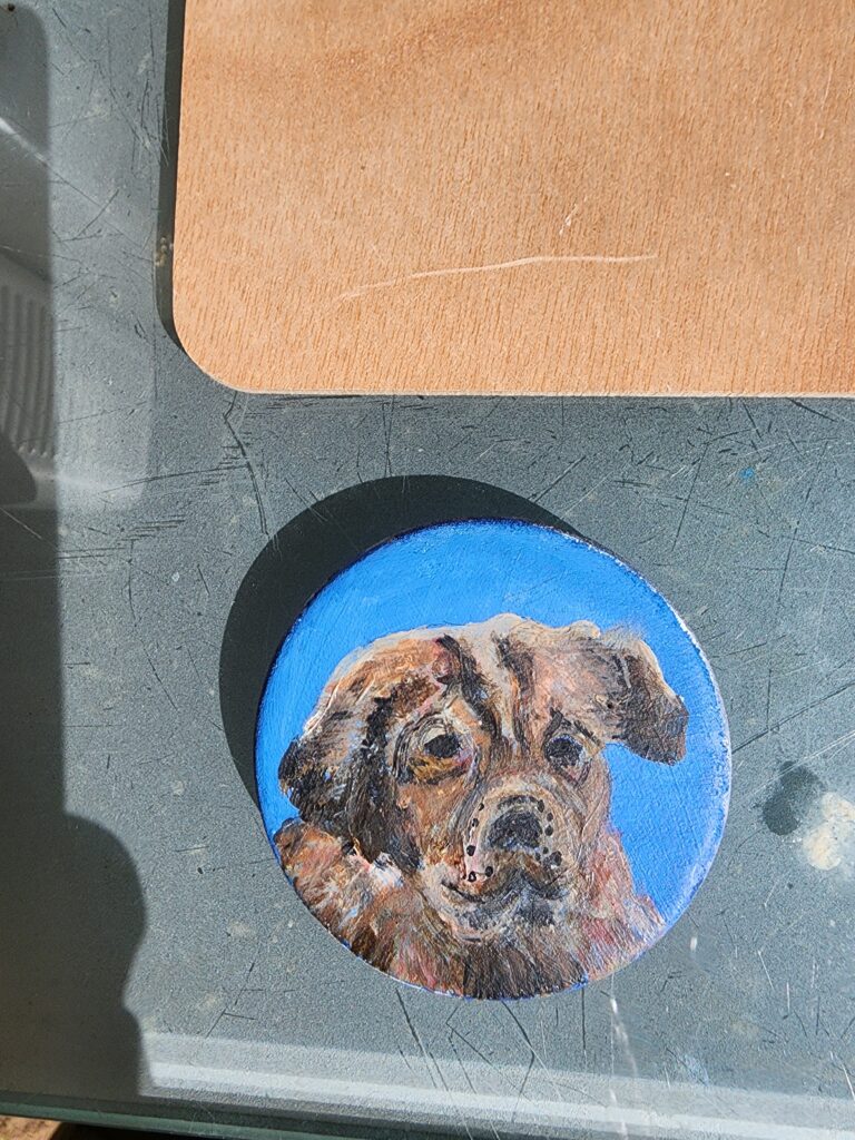 Chien de berger peint sur pierre